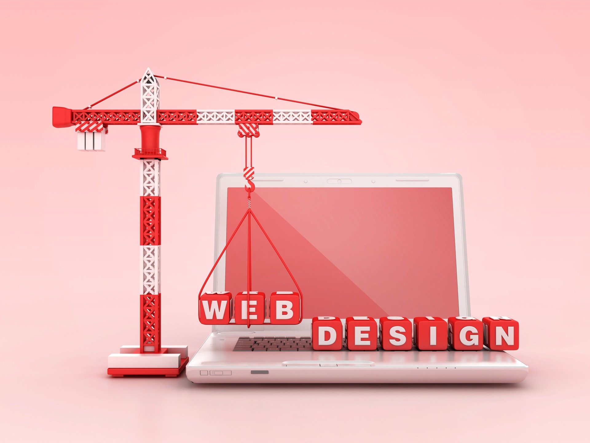 WEB DESIGN blocs avec grue à tour sur ordinateur portable